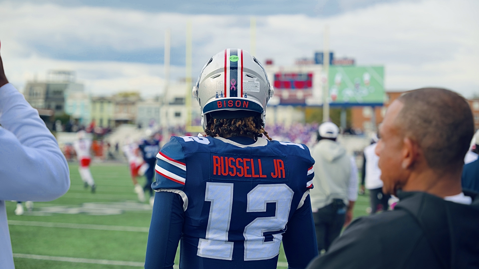 Howard Bison football player number 12 watching the game from the sideline